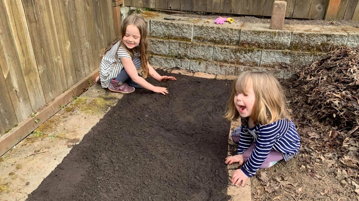 girls gardening in the backyard unexpected learning opportunities during coronavirus shut down